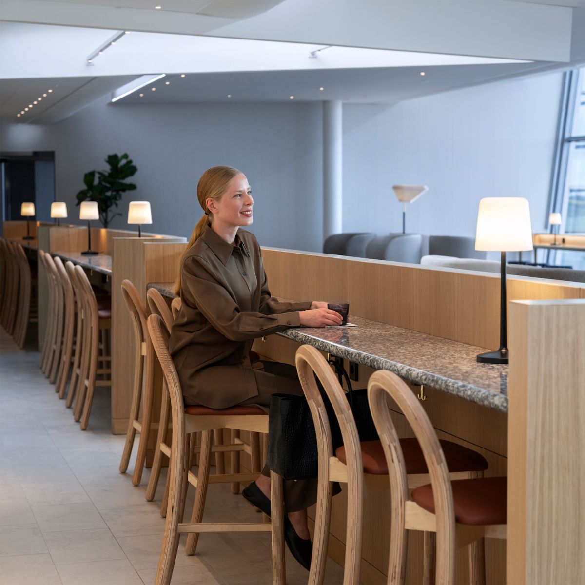 Finnair business lounge experience woman data